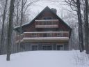 Front view of Alpine Snow Cabin in Gaylord Michigan.
