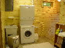 Laundry area of Alpine Snow Cabin. Featuring washer, dryer and laundry tub.