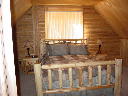 Master bedroom on second level of Alpine Snow Cabin.